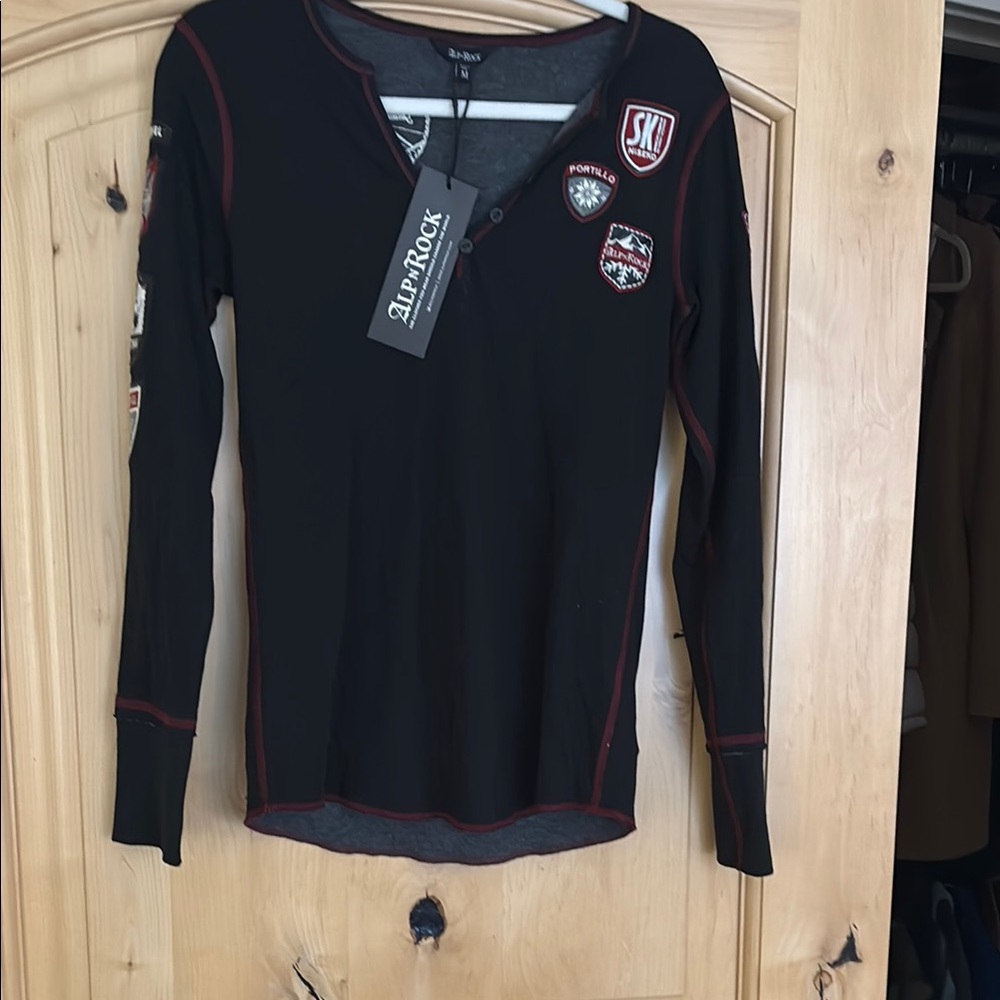 Alp n Rock Fitted Black Long Sleeve Tee with skiers badges.Alpine ski wear.